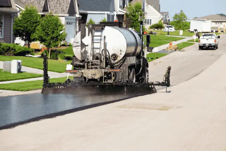 Professional asphalt paving machine laying fresh bitumen on a residential street in Perth